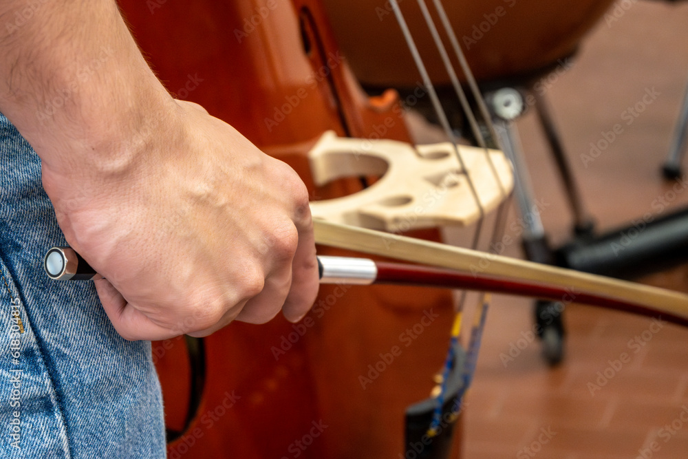 Real life young music students during rehearsals. Musical instruments and music stand with stave. Real life young music students during rehearsals. Musical instruments and music stand with stave.