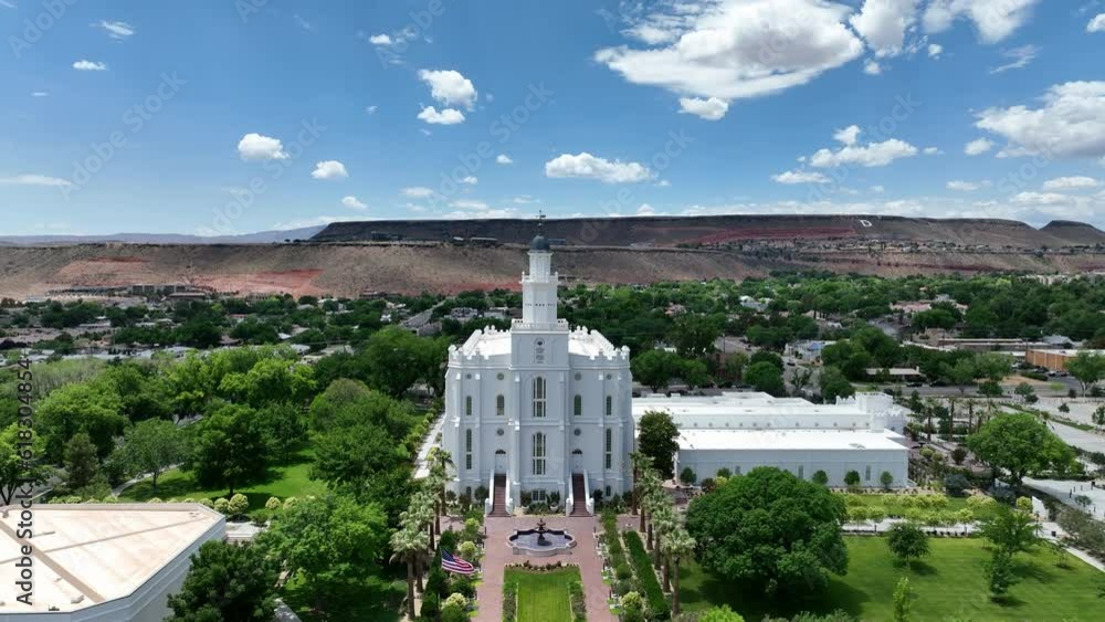 Aerial St George Utah LDS Temple pull turn. Southwestern desert. Pioneer temple in residential area built in 1877. First LDS temple in Utah. The Church of Jesus Christ of Latter-day Saints. Aerial St George Utah LDS Temple pull turn. Southwestern desert. Pioneer temple in residential area built in 1877. First LDS temple in Utah. The Church of Jesus Christ of Latter-day Saints.