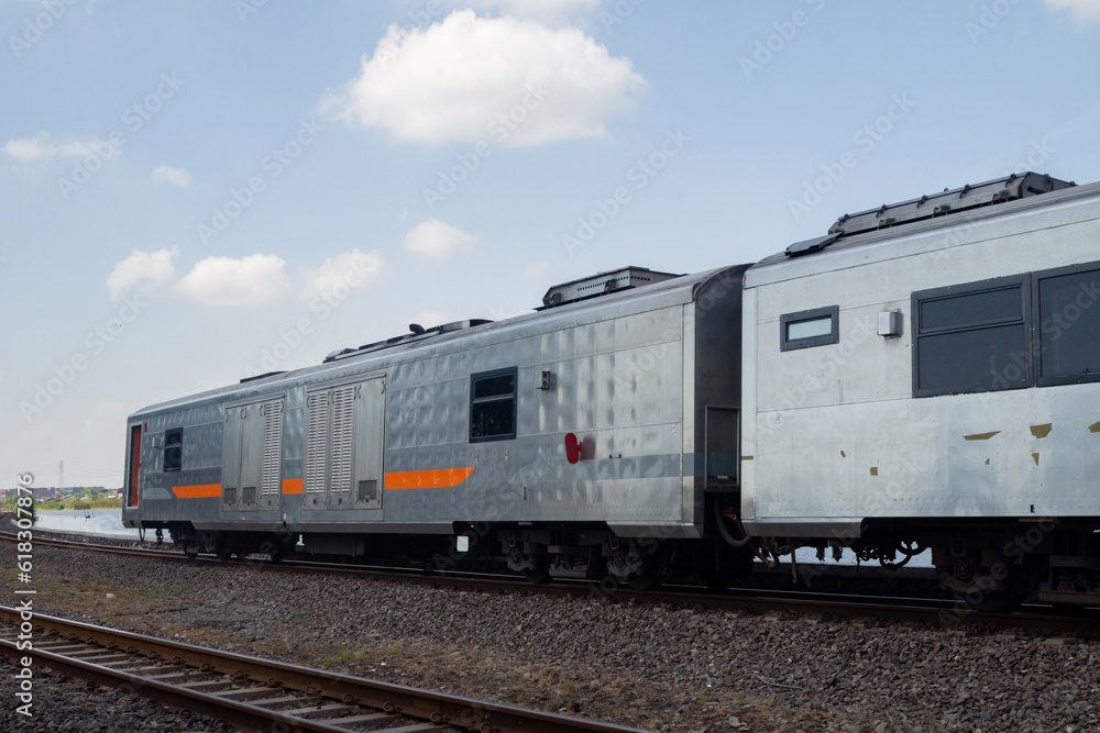 Domestic train pass the rail way when day time with blue sky. Domestic train pass the rail way when day time with blue sky.