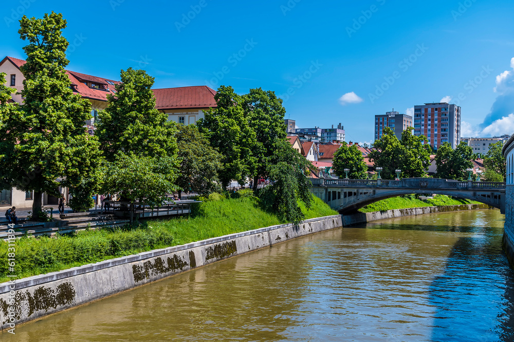 A view from the Butchers Bridge towards the Dragon Brdige over the River Ljubljanica in Ljubljana, Slovenia in summertime