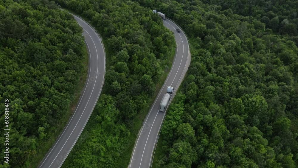 Aerial Drone View truck Drive on Curvy Mountain asphalt Road in Spring Aerial Drone View truck Drive on Curvy Mountain asphalt Road in Spring