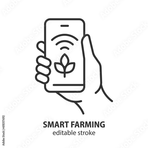 Smart farming vector line icon. Hand holding smartphone with plant growth control app. Editable stroke.