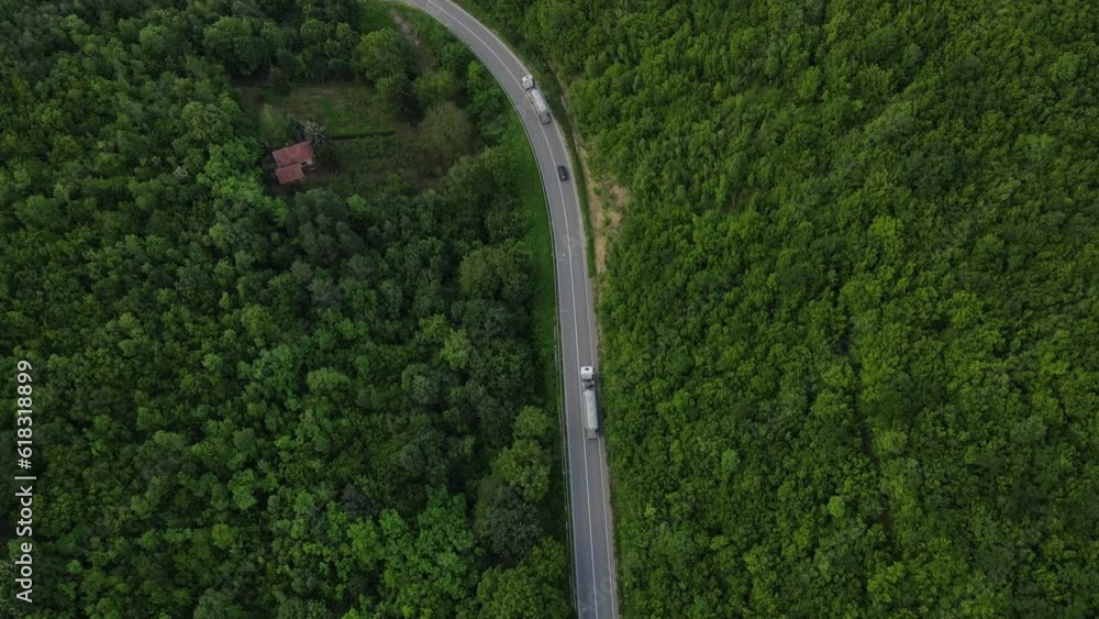 Aerial Drone View truck Drive on Curvy Mountain asphalt Road in Spring Aerial Drone View truck Drive on Curvy Mountain asphalt Road in Spring