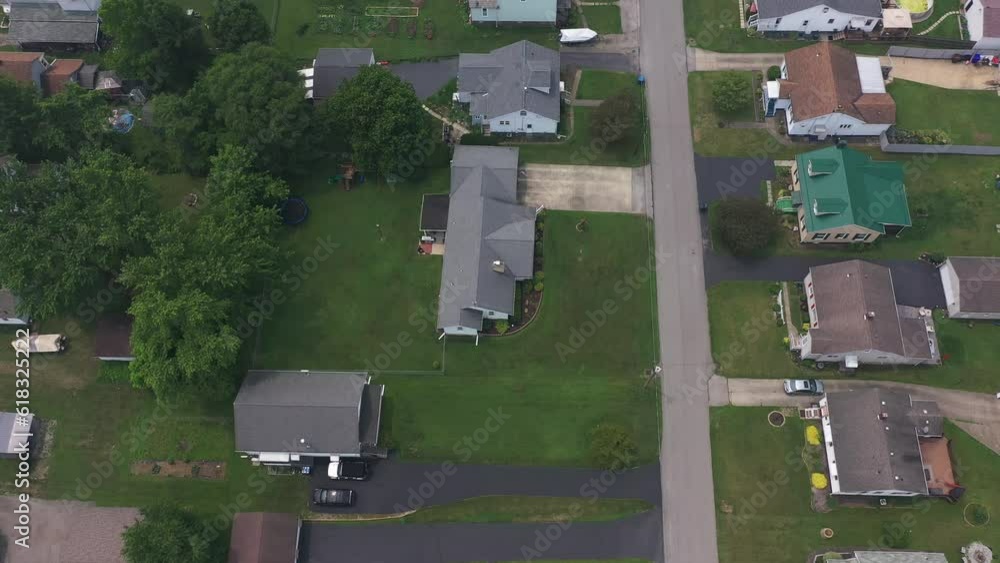 A reverse tilt up aerial view of the small unincorporated community of
