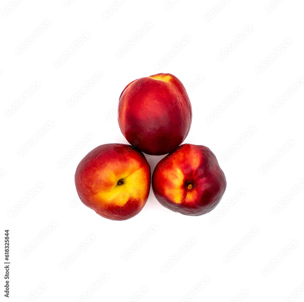 Close up studio photo of three ripe whole nectarine fruits