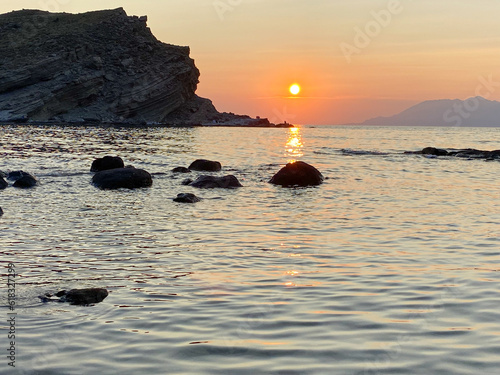 view of Samothrace island at sunset from Yıldızkoy beach in Imbros island, Gokceada, Çanakkale Turkey photo