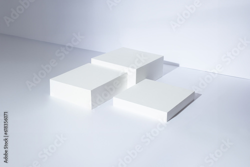 Modern and minimal style, white cube step podium with white wall scene background. Abstract white geometric shape photography for product display presentation, 3D, stage showcase.