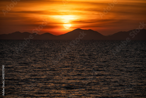 sunset over the sea and mountains