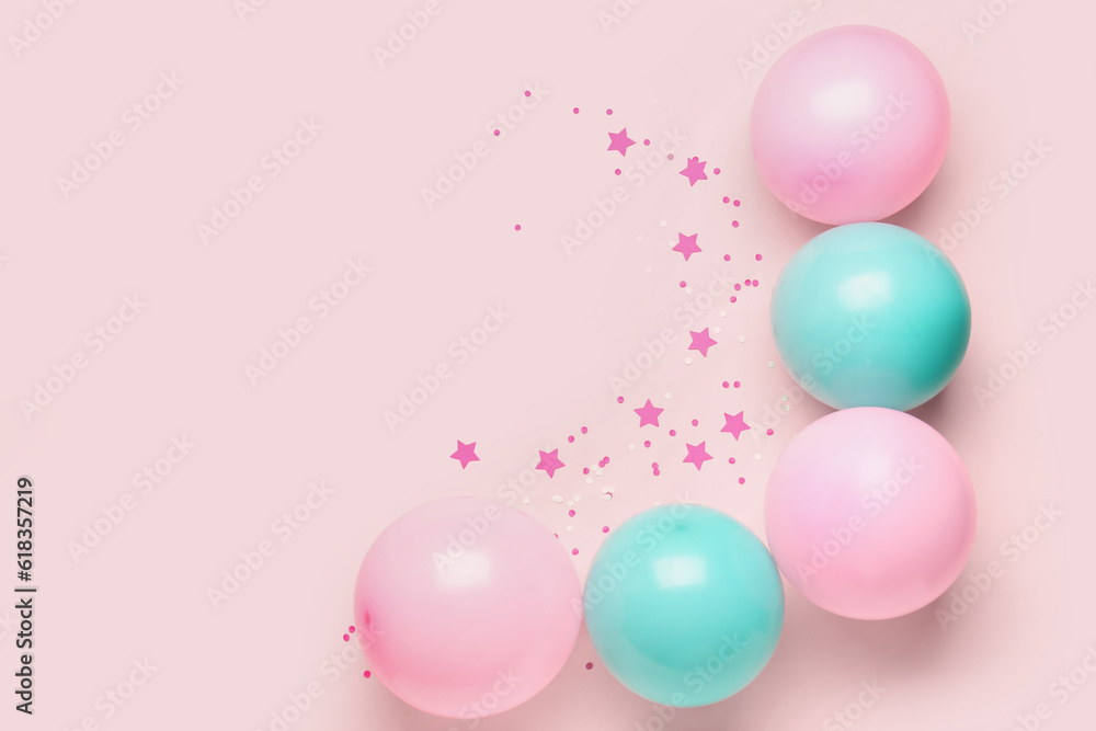 Blue and pink balloons with serpentine on color background Blue and pink balloons with serpentine on color background