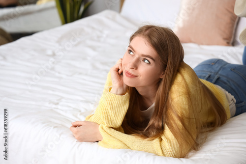 Dreaming young woman lying ...