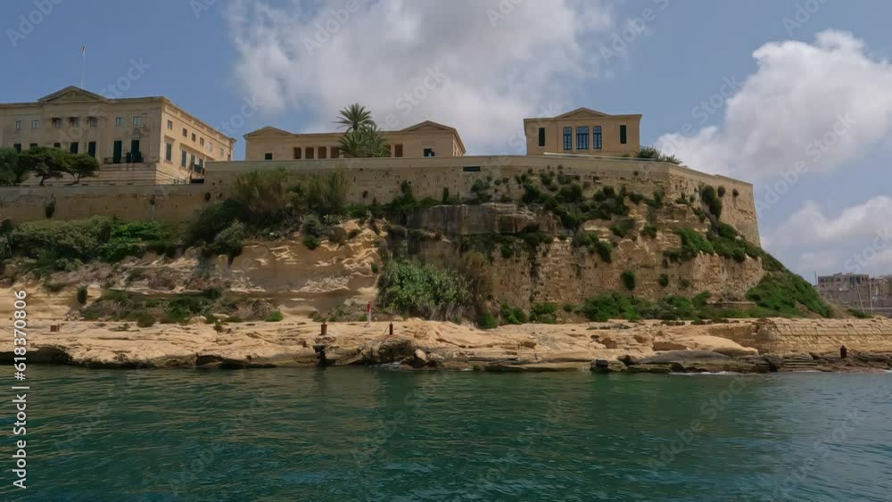 historic tan architecture and walled buildings of valletta malta, view from boat historic tan architecture and walled buildings of valletta malta, view from boat