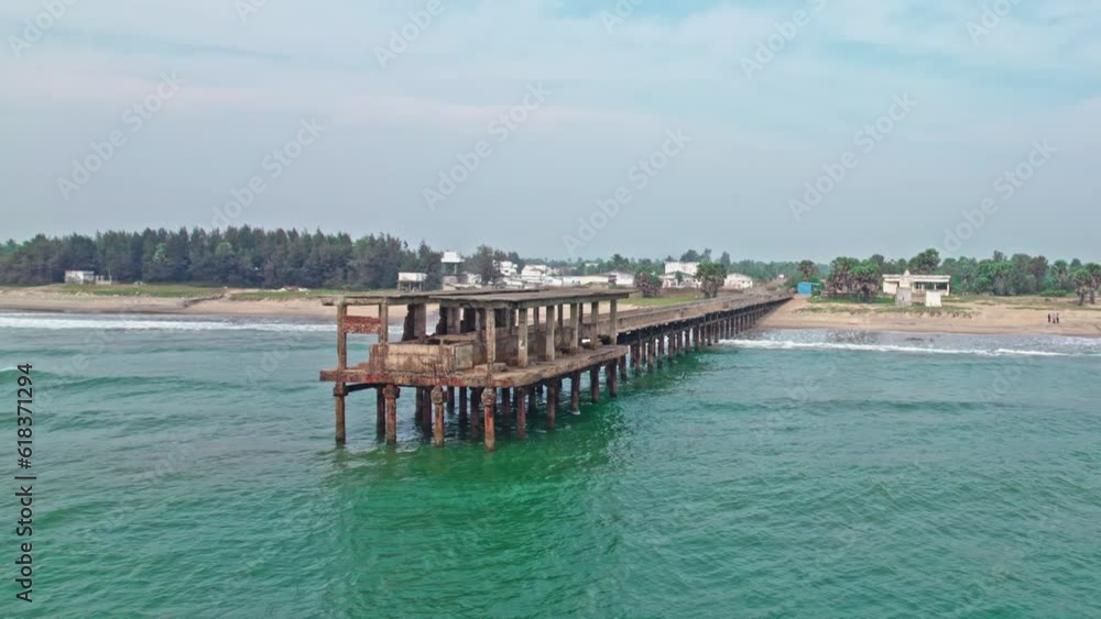 abandoned walking bridge in to the sea lay to ruins drone shot addaripeta beach 4k abandoned walking bridge in to the sea lay to ruins drone shot addaripeta beach 4k