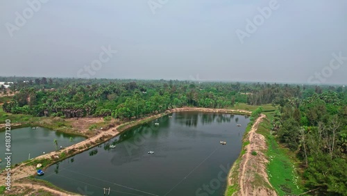 areal view of trees ponds houses and beach drone shot 4k photo