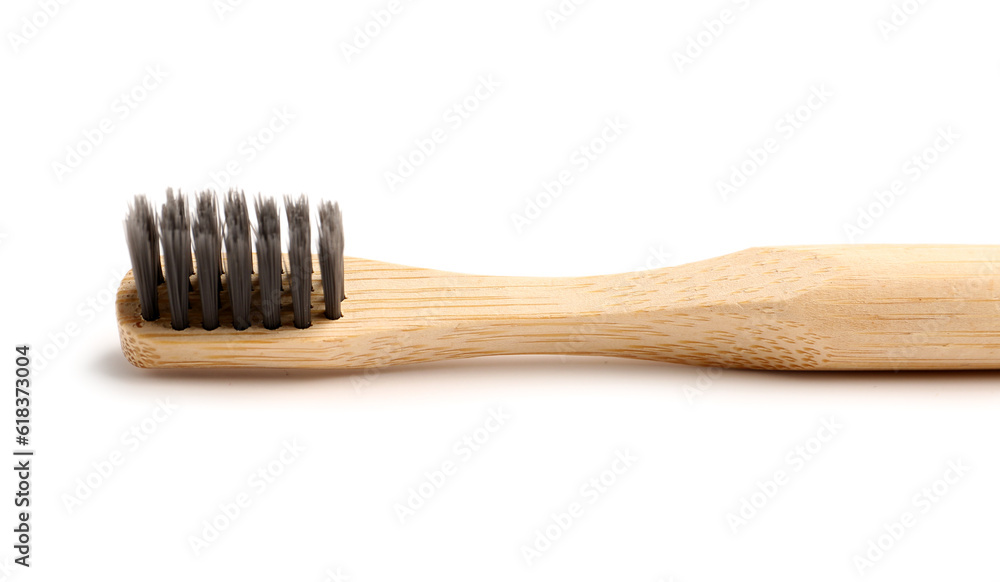 Bamboo tooth brush on white background, closeup Bamboo tooth brush on white background, closeup