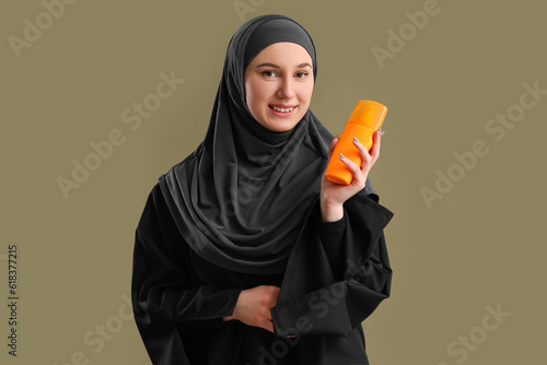 Young Muslim woman with sun...