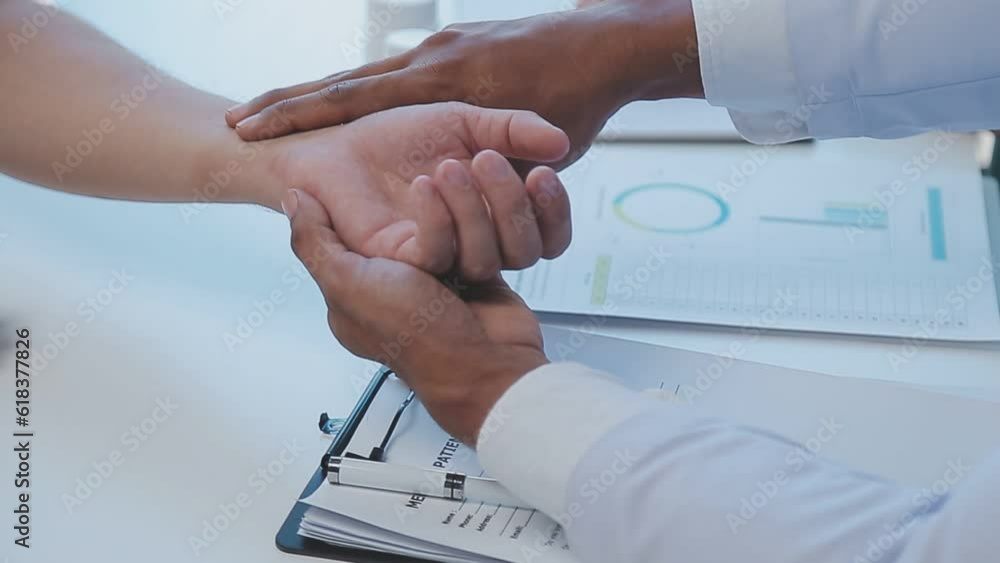 Group of healthcare workers and businessman using laptop while having a meeting in the office. Focus is on young doctor. Group of healthcare workers and businessman using laptop while having a meeting in the office. Focus is on young doctor.