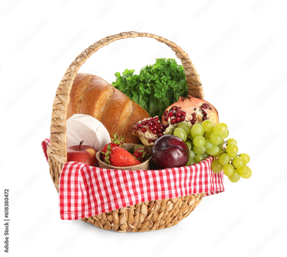 Wicker basket with delicious food for picnic on white background Wicker basket with delicious food for picnic on white background