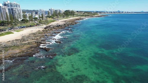 Rocky Shores And Holiday Apartments At Mooloolaba Beach In Sunshine Coast, Queensland. aerial pullback photo