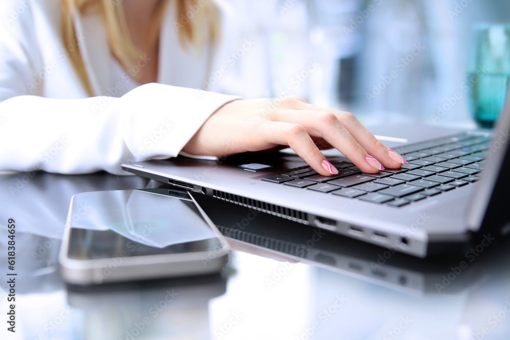 Businesswman is using a smartphone and laptop. Businesswman is using a smartphone and laptop.
