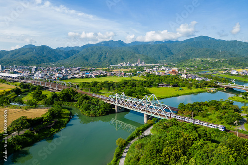 Canvas Print Train pass the iron bridge at dongshan river eco park in yilan, taiwan