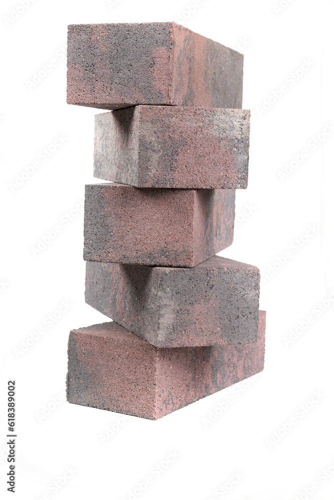 white background. brick made of concrete. multi-colored block for laying a post on the fence. close-up. white background. brick made of concrete. multi-colored block for laying a post on the fence. close-up.