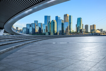 City square and skyline with modern buildings in Chongqing at sunrise, China.