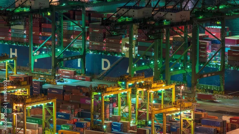 Zoom out Time lapse video of working gantry cranes at Singapore container port at night. Zoom out Time lapse video of working gantry cranes at Singapore container port at night.
