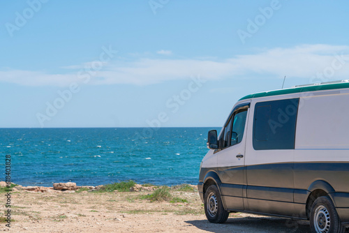 House on the wheels / Camper van on the seaside, travel in vacation © Vsl