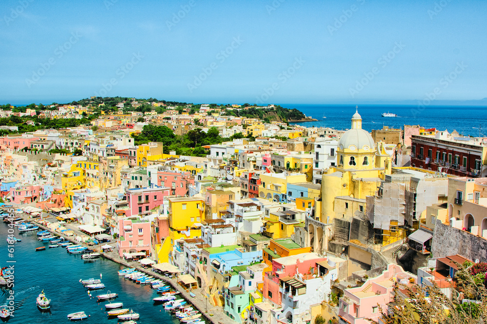 Procida bellisima island in Italy with colorful houses tourist destination where to go in vacancy. Sea with boats and yachts where you can swim and have fun 