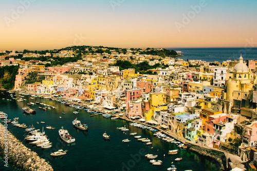 Fototapeta Naklejka Na Ścianę i Meble -  Procida bellisima island in Italy with colorful houses tourist destination where to go in vacancy. Sea with boats and yachts where you can swim and have fun 