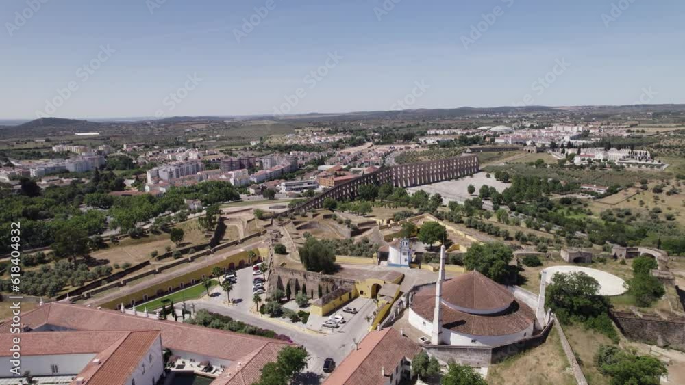 Aerial View Over Our Lady Of Conception Church In Elvas With Amoreira Aqueduct In Background. Circle Dolly Shot Aerial View Over Our Lady Of Conception Church In Elvas With Amoreira Aqueduct In Background. Circle Dolly Shot