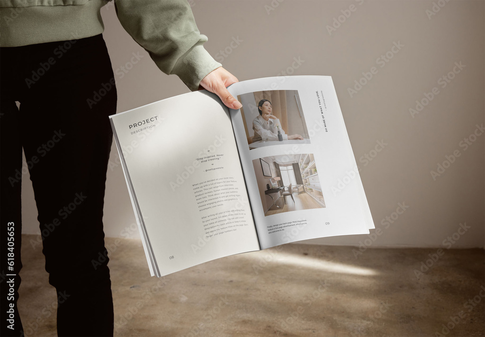 Mockup of person holding open vertical A4 magazine with customizable ...