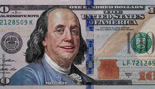 Benjamin Franklin smiling on 100 dollar banknote