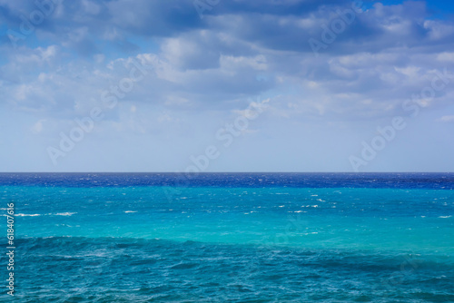View in Greece of mediterranean sea with blue hues and cloudy sky