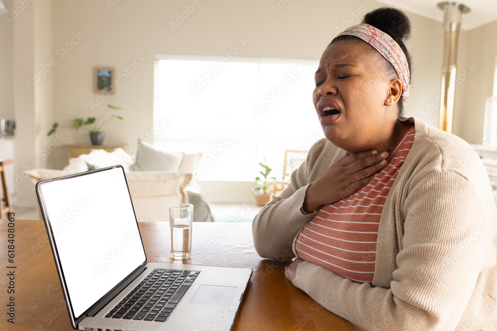 African american woman using laptop with copy space for online consultation with doctor African american woman using laptop with copy space for online consultation with doctor