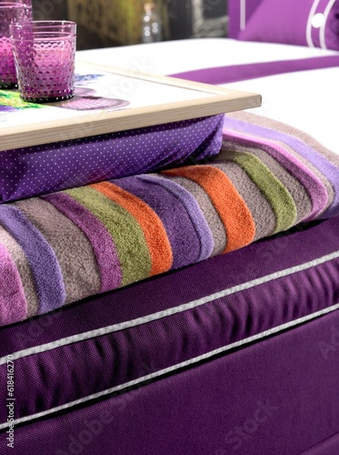 Breakfast served on a purple bedspread