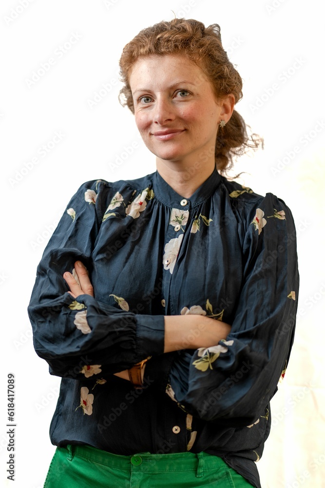Vertical of a ginger model posing, dressed in an elegant blue shirt on a white background Vertical of a ginger model posing, dressed in an elegant blue shirt on a white background