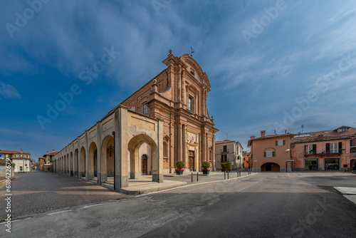 Fossano, Cuneo, Italy: parish church of San Filippo (18th century) in piazza Aldo Nicolaj with the arcade and the buildings of the historic center