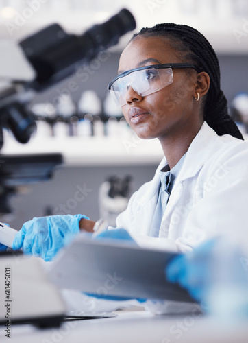 Computer, black woman or scientist reading research for online analysis, sustainability or innovation. Science, studying biotechnology or African ecology expert in a laboratory for agro development