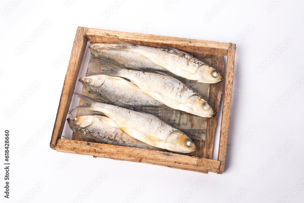 milkfish presto on a board isolated on a white background
