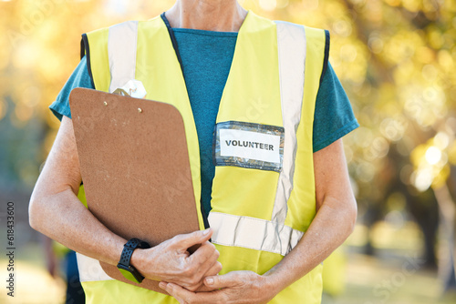 Clipboard, volunteering and person in park for cleaning, community service and pollution or sustainability checklist. Gardening, inspection and people hands for ngo or nonprofit, outdoor and nature photo