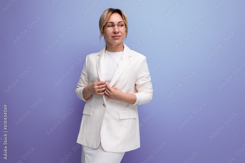 pretty young blond employer woman in white elegant jacket and skirt pretty young blond employer woman in white elegant jacket and skirt
