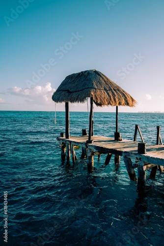 Picturesque dock situated near a tranquil ocean with rolling waves