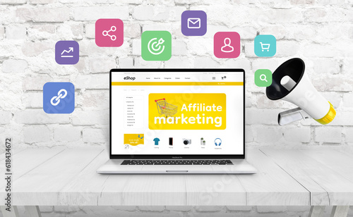 Ecommerce website offers affiliate marketing on laptop computer. Website design concept. Megaphone beside that throws out affiliate icons