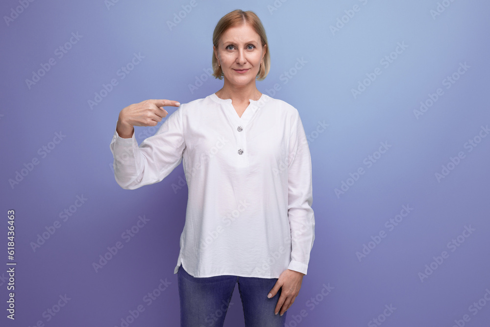 kind pleasant blond mature woman with clean face at menopause age in studio background kind pleasant blond mature woman with clean face at menopause age in studio background