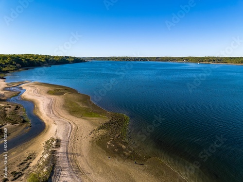 Aerial shot over West Neck Beach on Long Island in the suburb of Lloyd Harbor New York on sunny day © Audley C Bullock/Wirestock Creators
