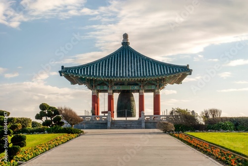 Ornately designed Korean Bell of Friendship in a lush  green park