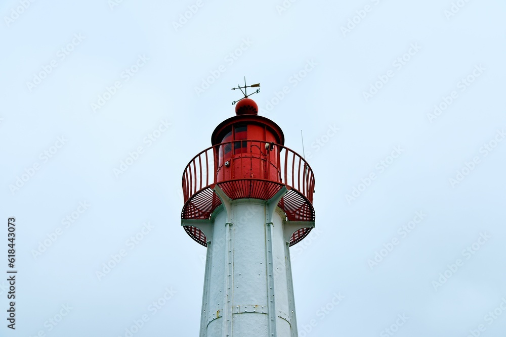 Trouville-sur-Mer lighthouse against a blue sky in France Trouville-sur-Mer lighthouse against a blue sky in France