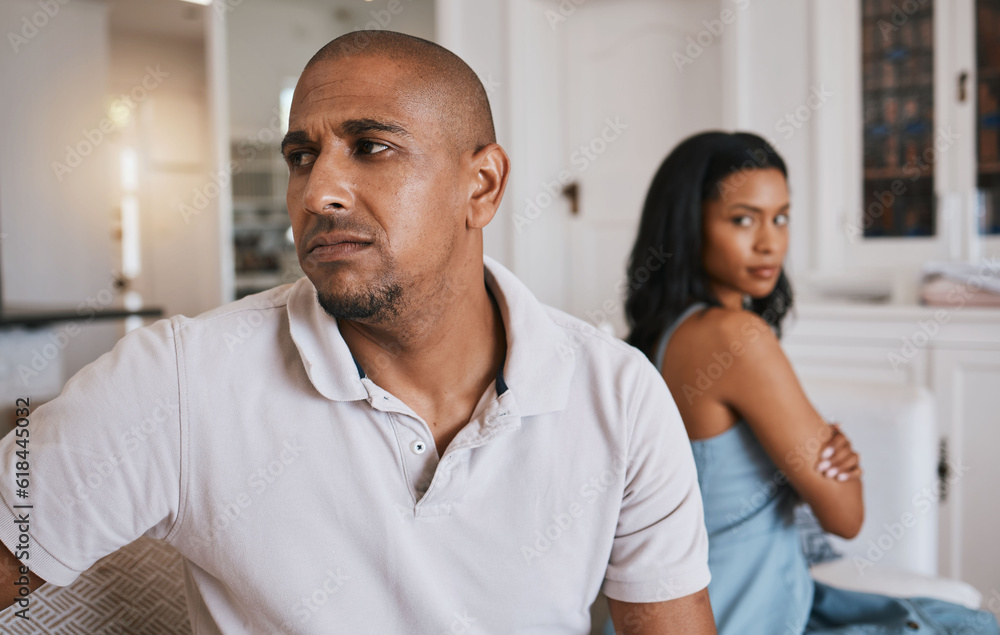 Fototapeta premium Couple, fight and frustrated on living room couch for worry, mistake or angry with anxiety in house. Man, woman or depression for conflict, drama or stress on lounge sofa for cheating, crisis or fail