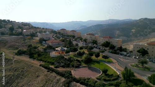 Wallpaper Mural Drone view over residential buildings on the road with a background of mountain landscapes Torontodigital.ca